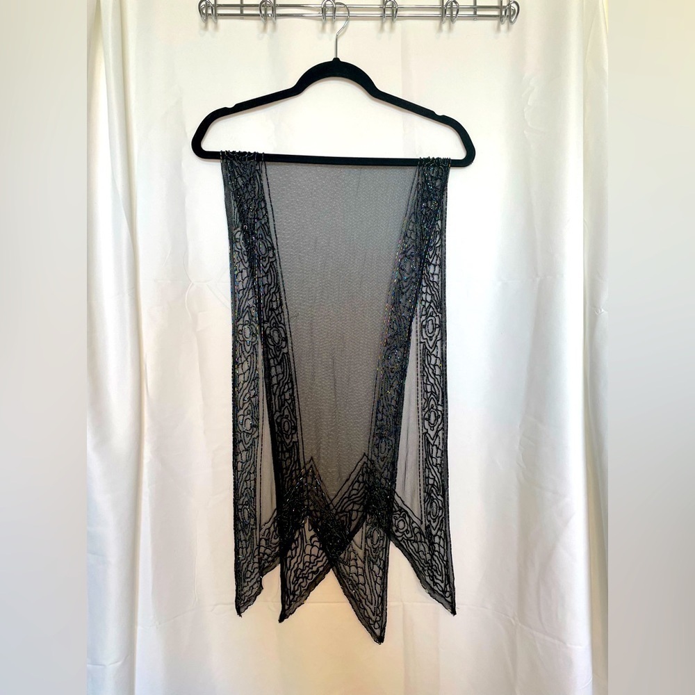 Black see through shawl with rainbow beaded accent around.​​​​​​​​​​​​
